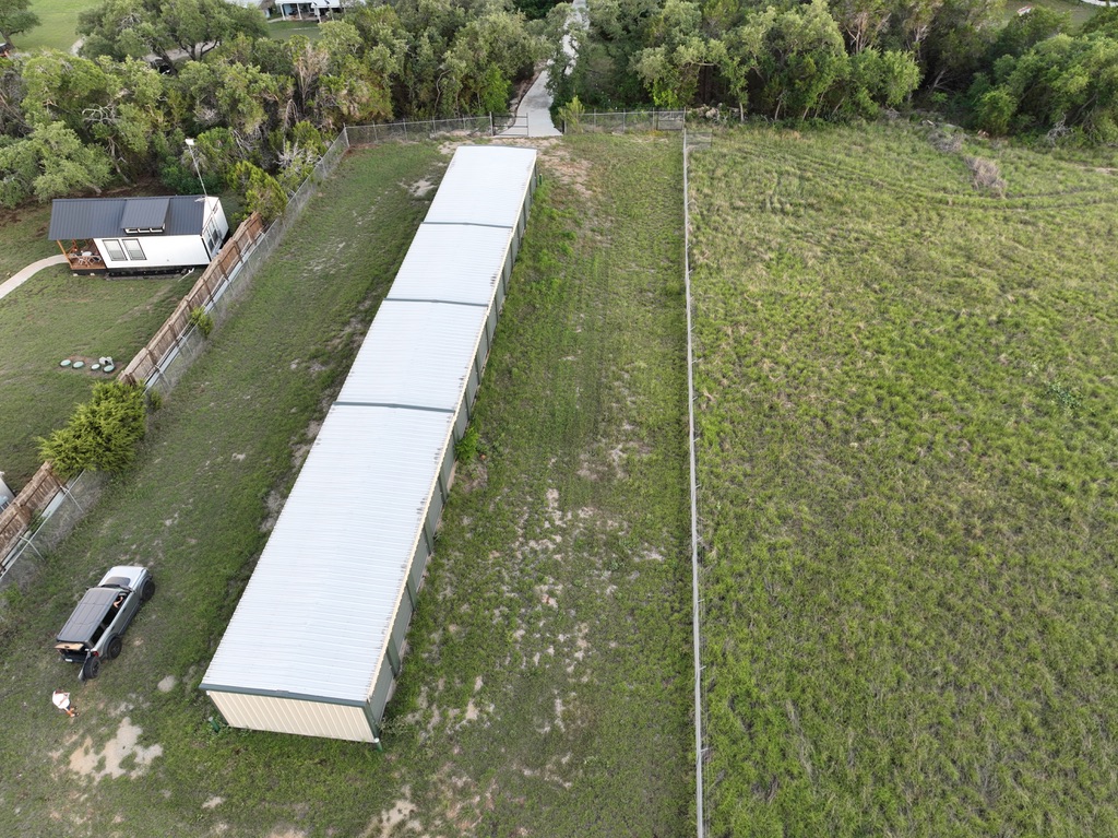 Aerial view of Dripping Springs Self Storage along the fence line