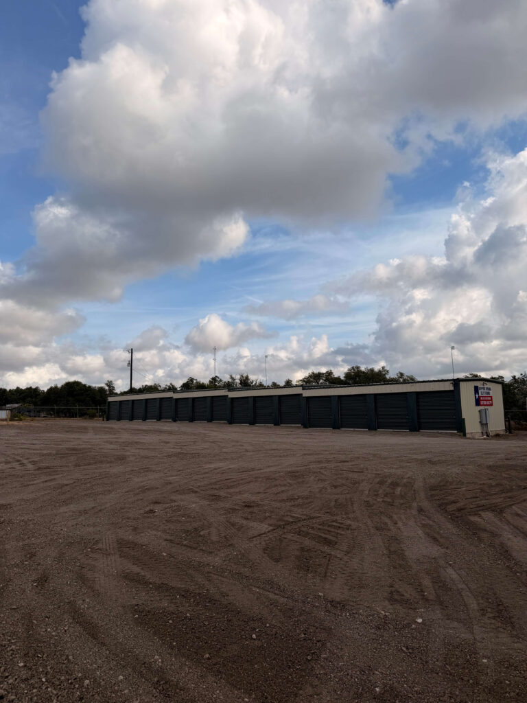 Row of enclosed drive-up storage units at Dripping Springs Self Storage