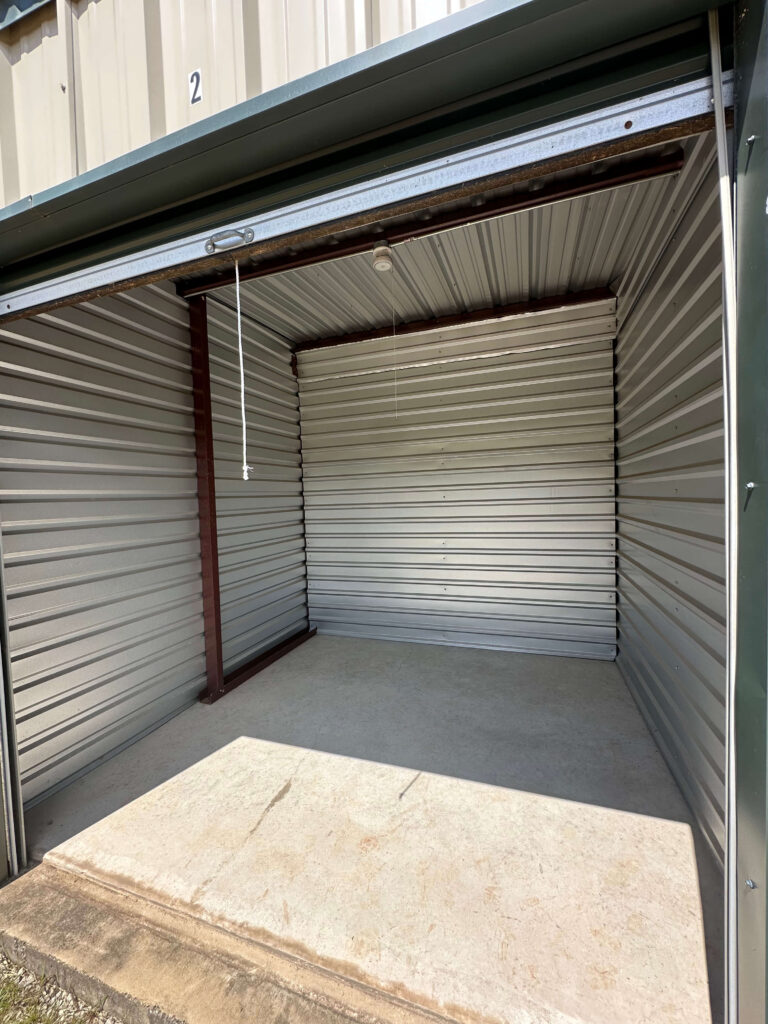 Clean interior of an enclosed storage unit with corrugated metal walls